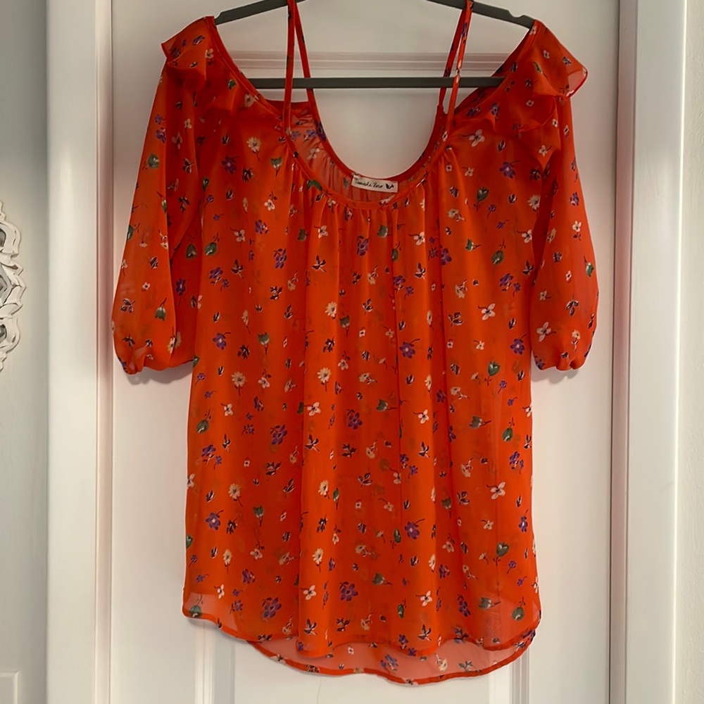 Double zero Off shoulder top. Orange and flower design